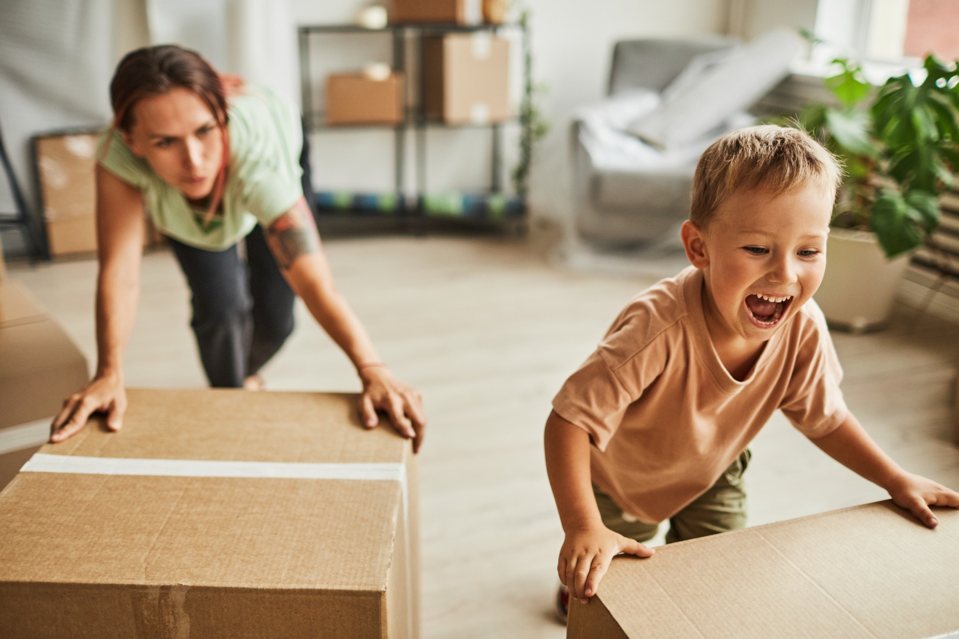 Family moving boxes in new house