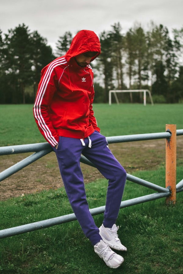 Boy in red hood and blue pants