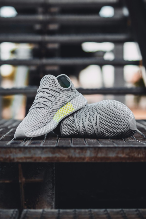 Pair of grey shoes on stair photo